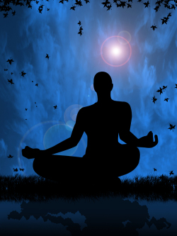 A silhouette of a person meditating.